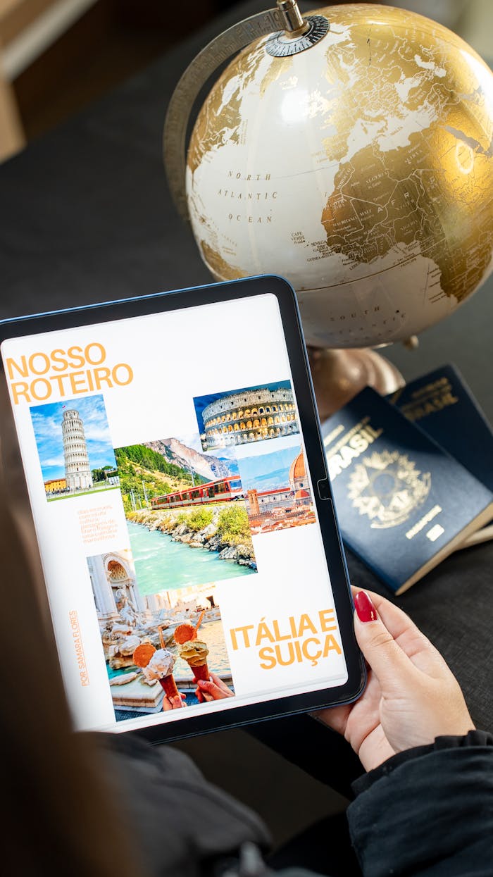 services-02 Person planning a trip to Italy and Switzerland using a tablet and globe.