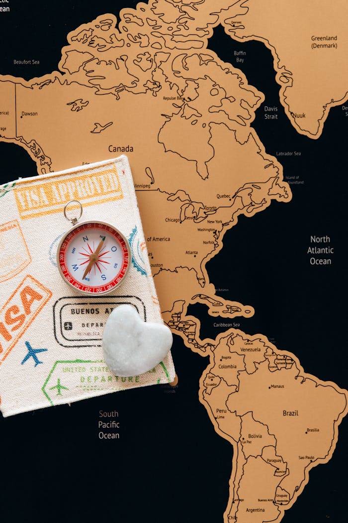 services-01 Flat lay photo of a map, passport, and compass, symbolizing travel and adventure.